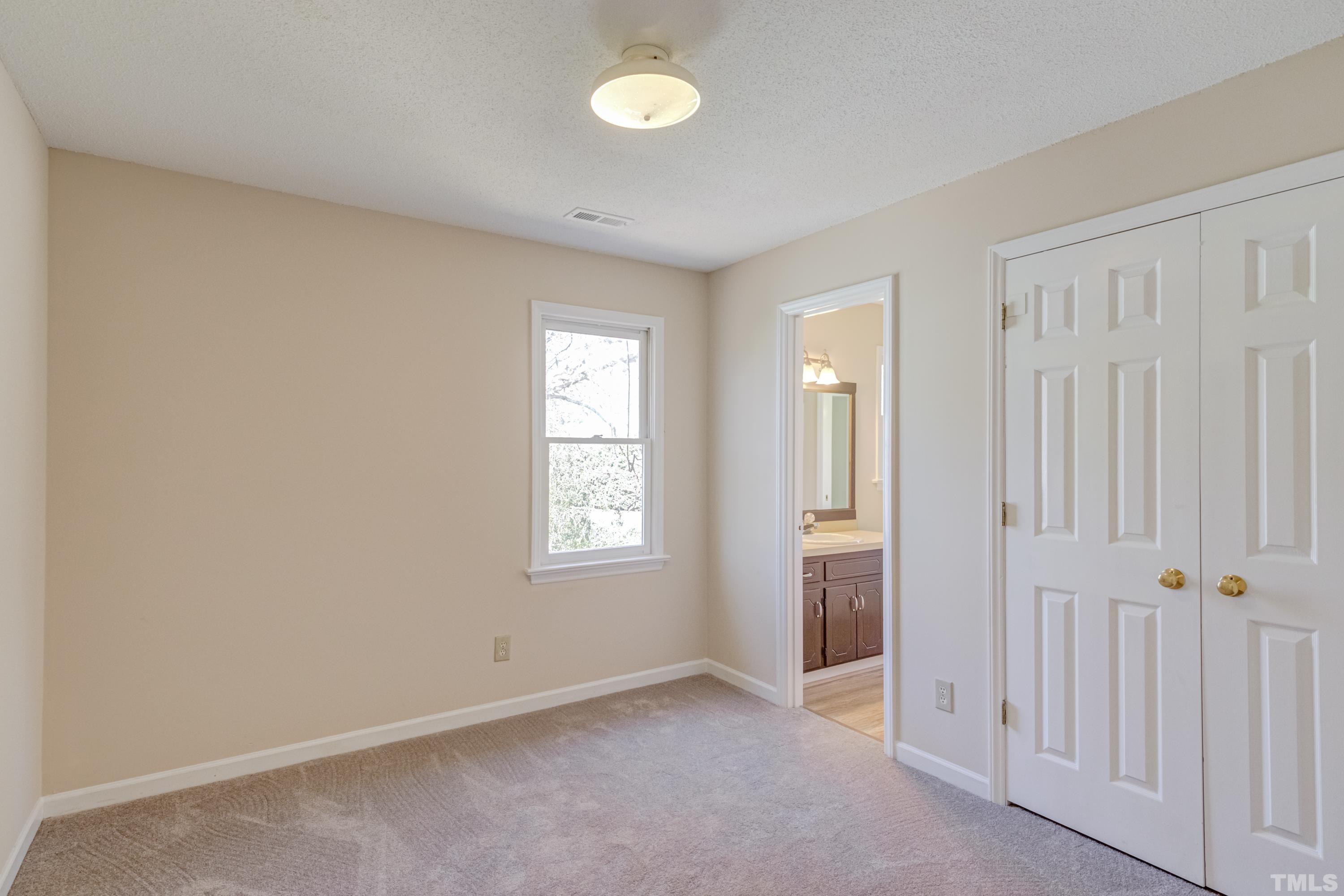 7307 Wilderness Road Raleigh, NC 27613 - Photo 13 of 14 an empty room with windows