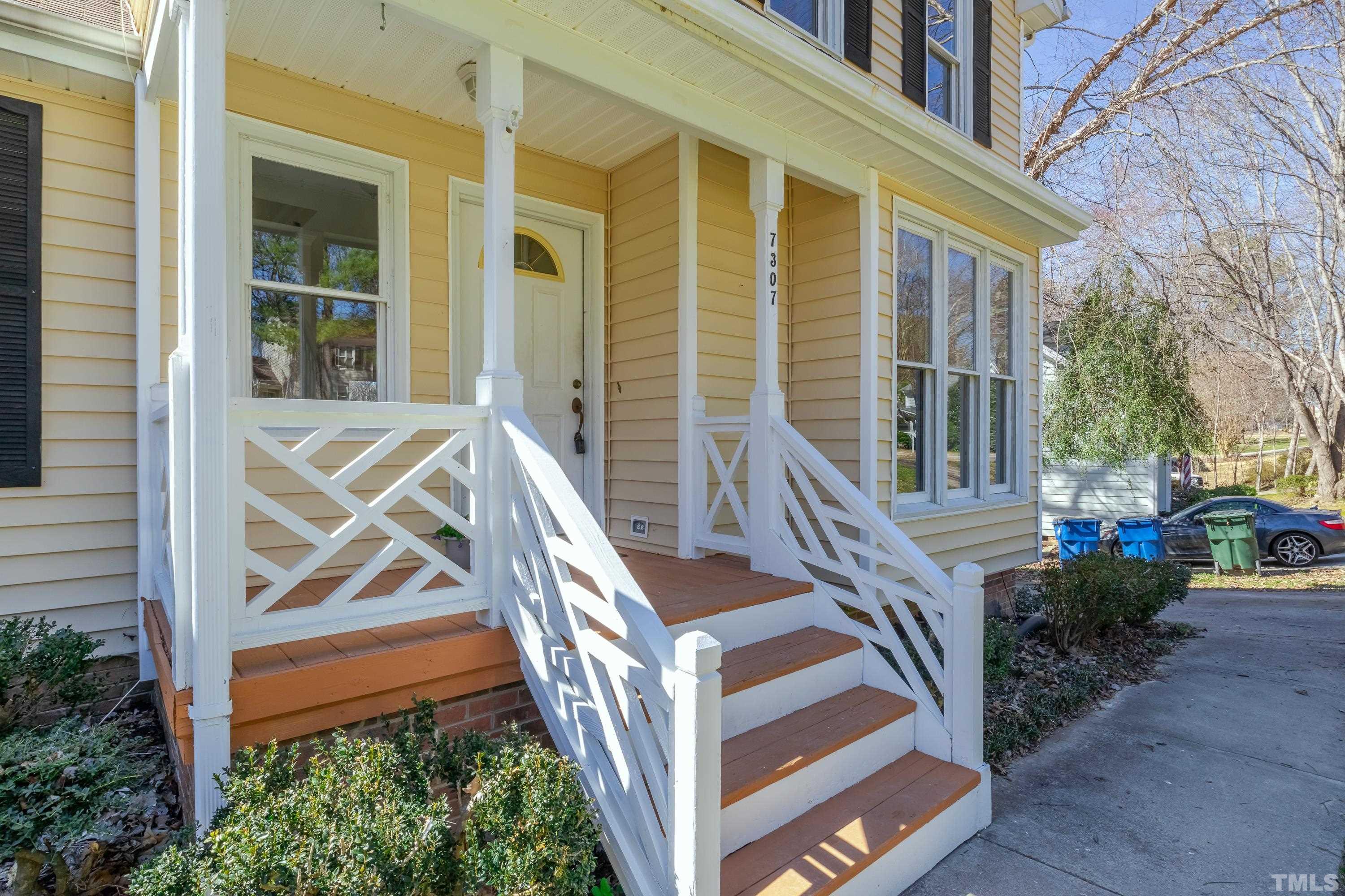 7307 Wilderness Road Raleigh, NC 27613 - Photo 3 of 14 a view of front door of house with stairs