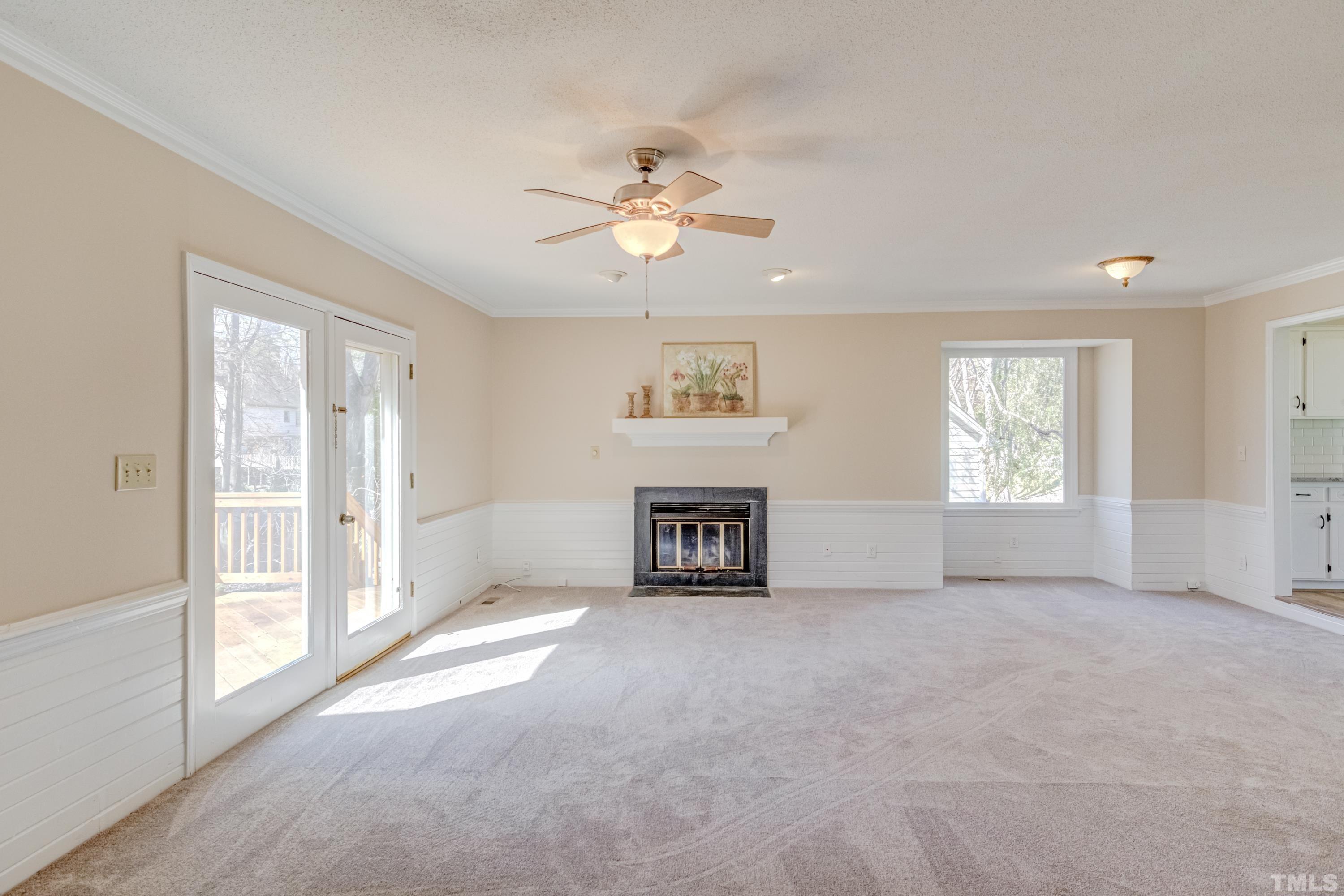 7307 Wilderness Road Raleigh, NC 27613 - Photo 4 of 14 a view of an empty room with a window