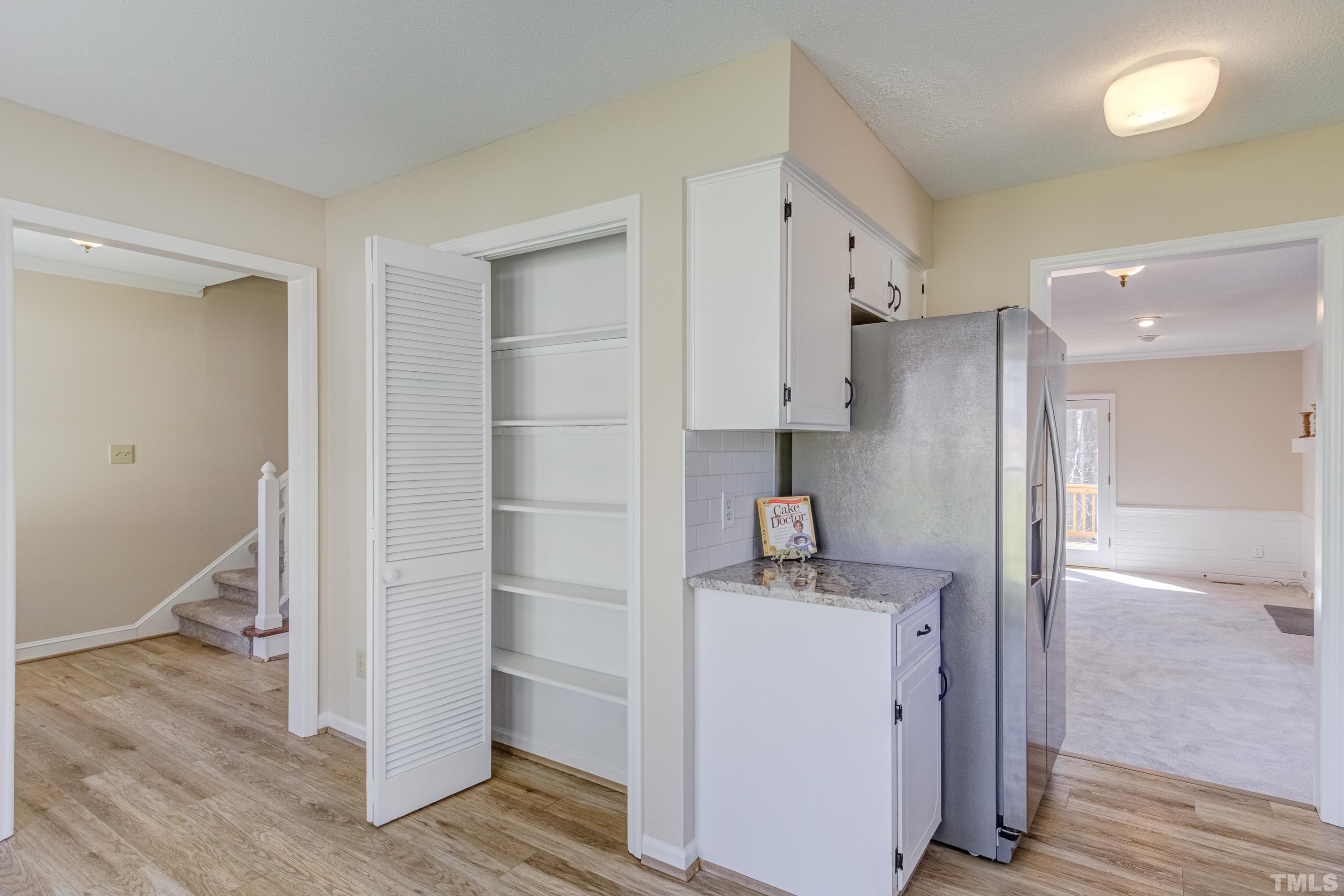 7307 Wilderness Road Raleigh, NC 27613 - Photo 9 of 14 a room with a washer and dryer