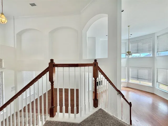 a view of staircase with wooden floor and stairs