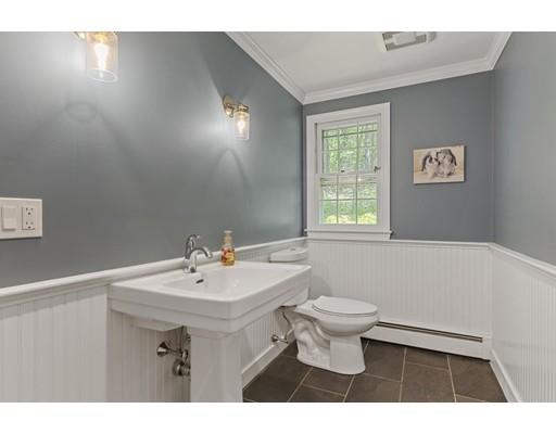 90 Rowley Bridge Road Topsfield, MA 01983 - Photo 13 of 23 a bathroom with a sink a toilet and a mirror