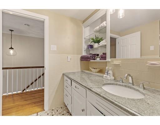 90 Rowley Bridge Road Topsfield, MA 01983 - Photo 19 of 23 a bathroom with a granite countertop sink a mirror and a shower