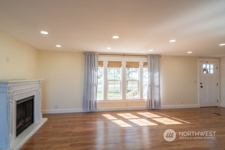 1963 Rd O Southeast Moses Lake, WA 98837 - Photo 11 of 18 a view of an empty room with wooden floor and a window