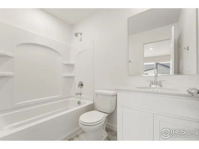 a front view of a house with a garage