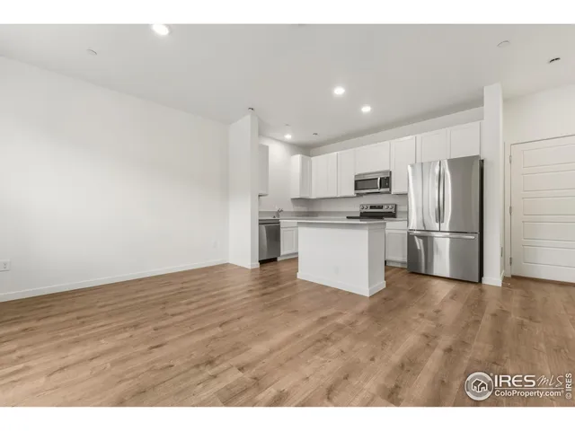 a view of kitchen with wooden floor