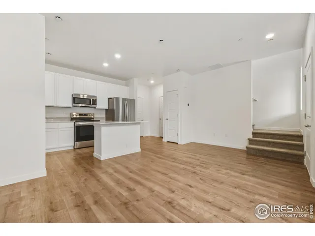 a view of kitchen with wooden floor
