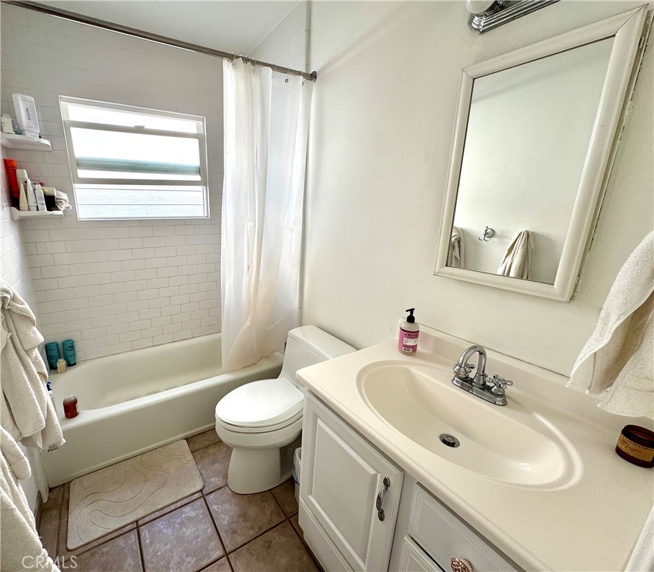 504 36th Street, Unit 1/2 Newport Beach, CA 92663 - Photo 9 of 15 a bathroom with a sink toilet and shower