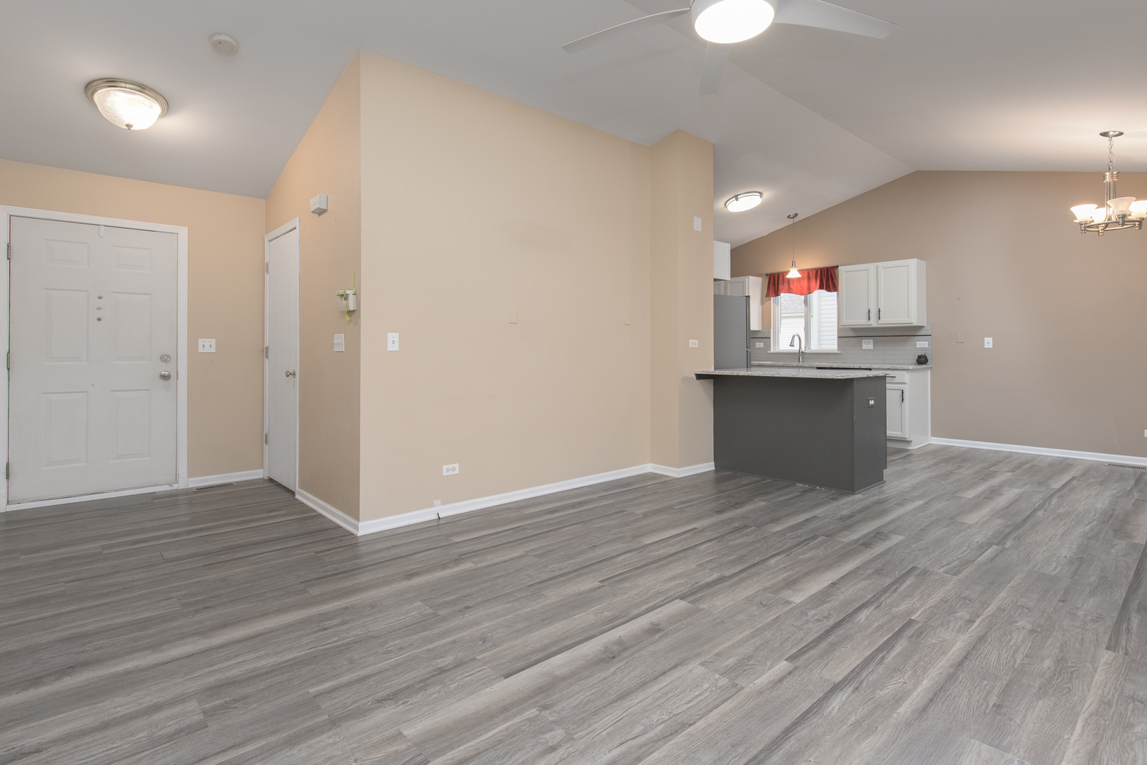 600 Indian Trail Road Antioch, IL 60002 - Photo 6 of 20 an empty room with wooden floor and fan