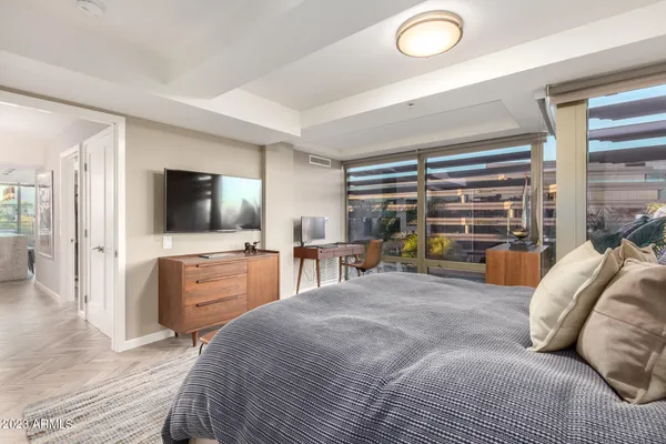 a bedroom with a bed and a dresser