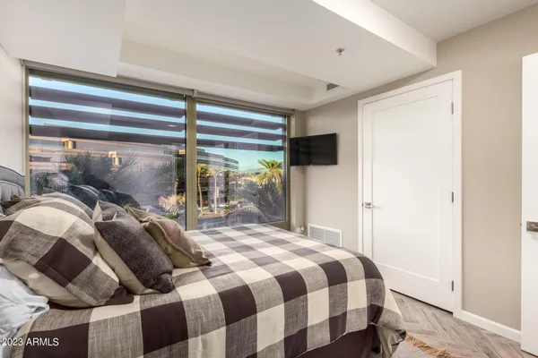 a bathroom with a granite countertop sink toilet and mirror