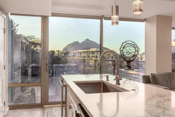 a kitchen with a sink and a refrigerator