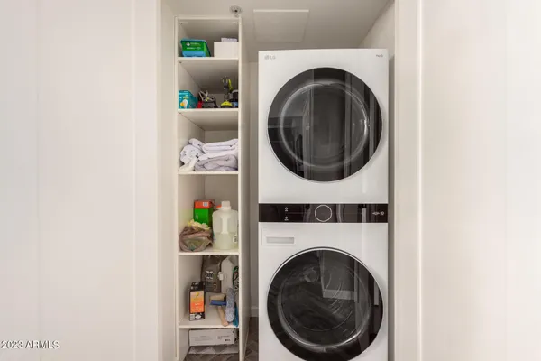 a view of a terrace with couches and a potted plant on a table