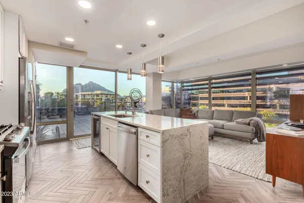 a living room with furniture and a large window