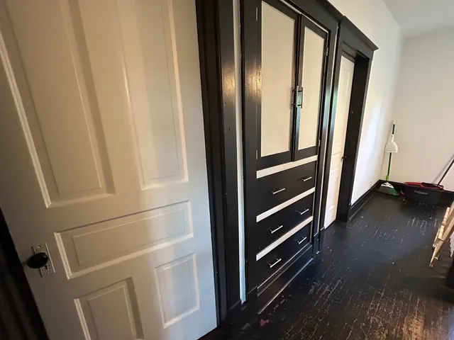 a view of walk in closet with empty racks