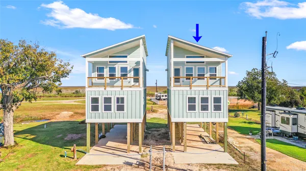 a front view of a house with a ocean view