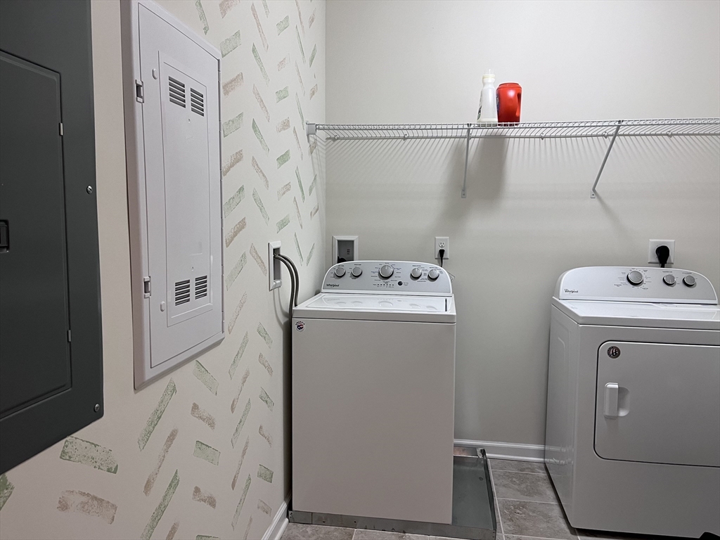 110 Trotter Road, Unit 308 Weymouth, MA 02190 - Photo 11 of 11 a utility room with dryer and washer