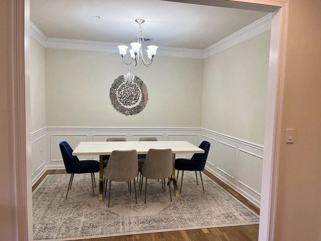 110 Trotter Road, Unit 308 Weymouth, MA 02190 - Photo 6 of 11 a view of a dining room with furniture