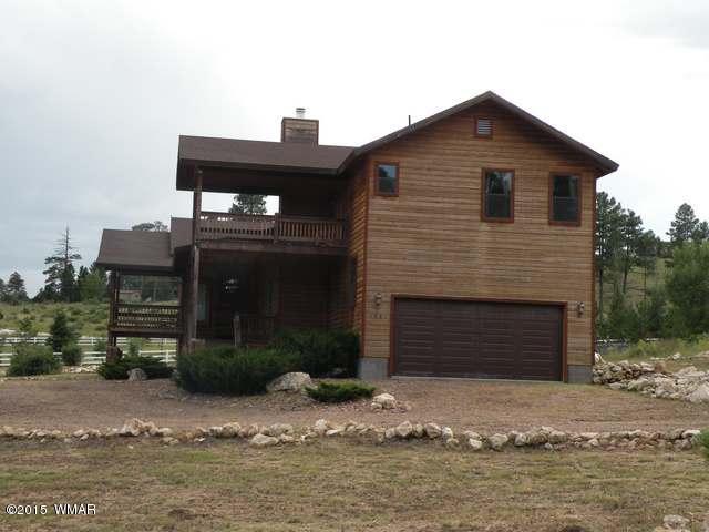 1851 Ansell Road Heber, AZ 85928 - Photo 3 of 24 a front view of a house with a yard