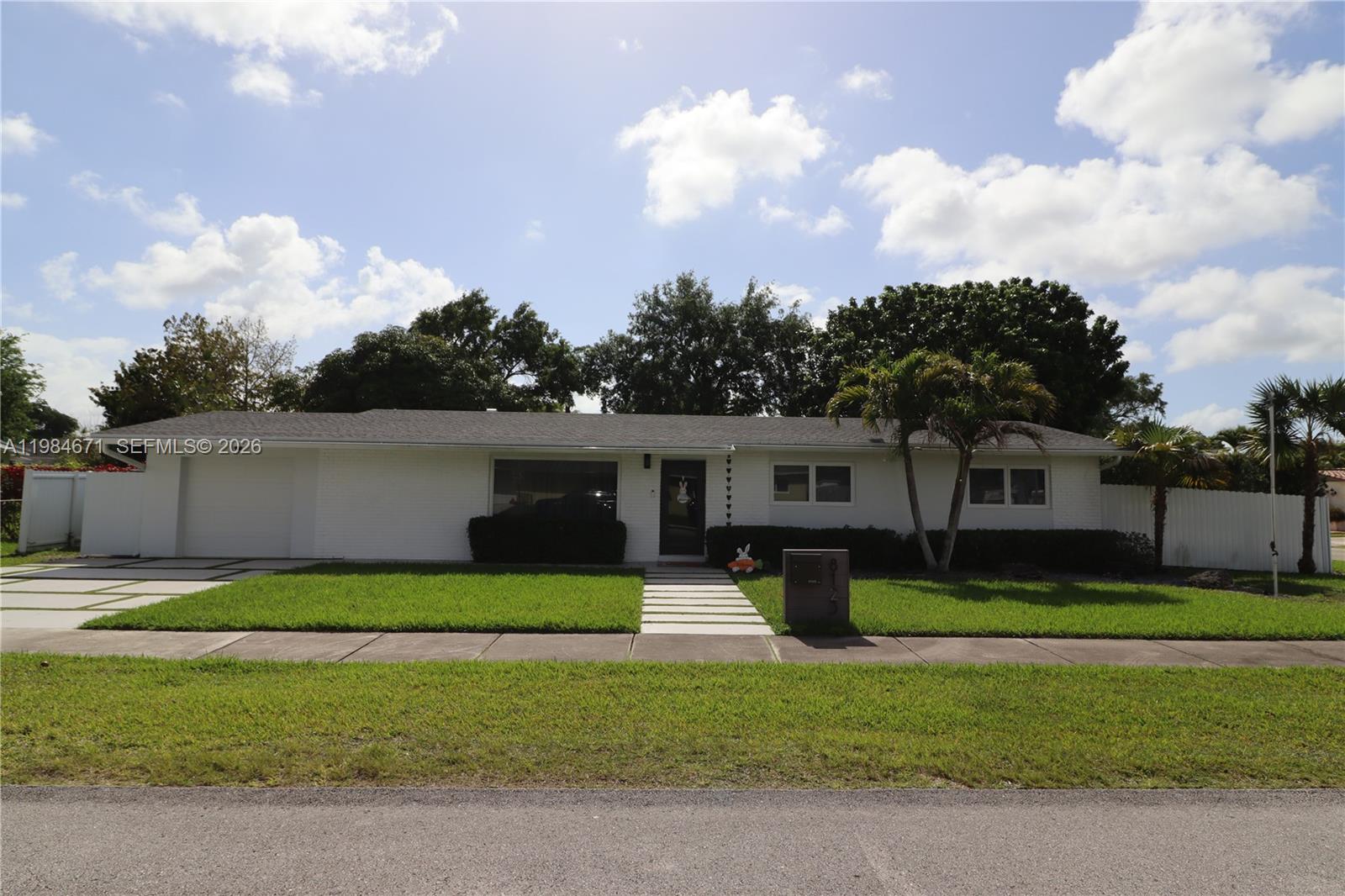 8123 Southwest 95th Court Miami, FL 33173 - Photo 1 of 5 a front view of a house with garden