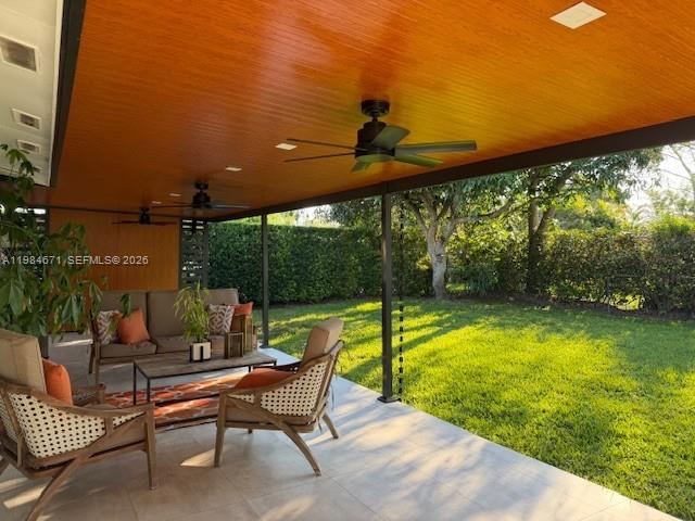 8123 Southwest 95th Court Miami, FL 33173 - Photo 3 of 5 a swimming pool with lawn chairs and wooden fence