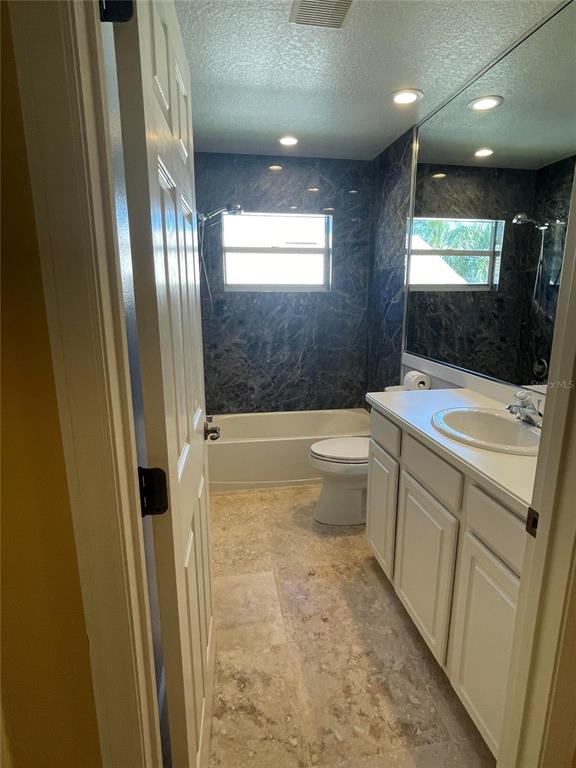 759 Fordingbridge Way Osprey, FL 34229 - Photo 22 of 51 a bathroom with a sink a toilet a mirror and bathtub