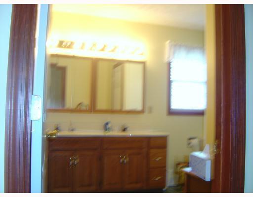 2660 Ridge Rd Extension Economy, PA 15005 - Photo 14 of 18 Master Bath/Spa. Truly a generous size without wasting space....Double sink/vanity....and additional vanity for makeup...Linen closet....Full shower/bath unit....Access the walk-in-closet with its hide-away ironing board...well designed