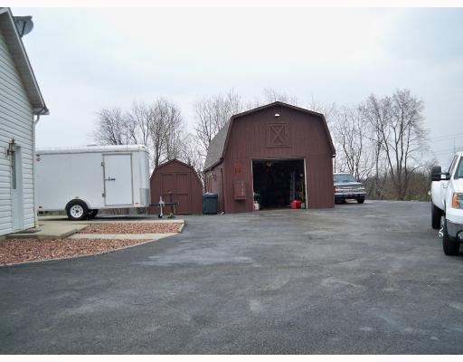 2660 Ridge Rd Extension Economy, PA 15005 - Photo 16 of 18 Land/Lot. The man-door at left is the craft shop currently but can be converted back to 3rd garage. There is more than enough room to store all your toys...boats, cars, RV s, trailors....or for huge gatherings