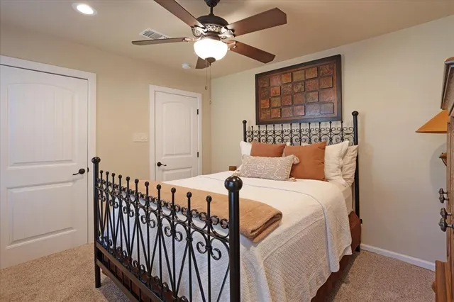 a kitchen with stainless steel appliances granite countertop a stove a sink dishwasher and a dining table with chair