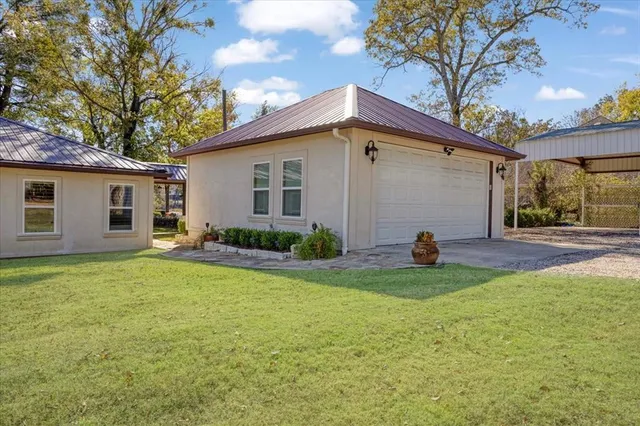 a view of a table and chairs in the garden