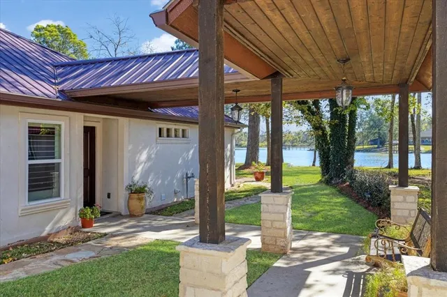 a view of a house with backyard porch and sitting area
