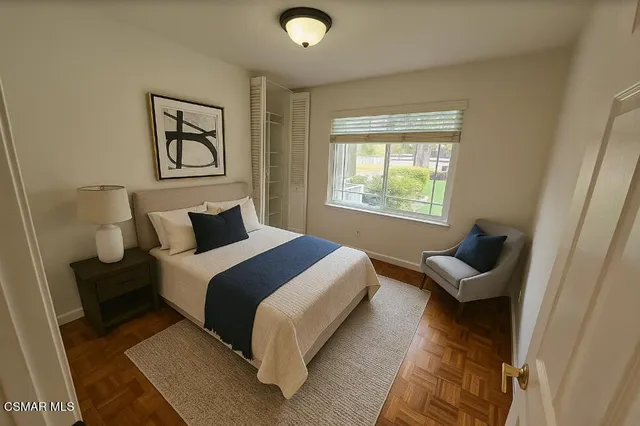 a bedroom with a bed and window