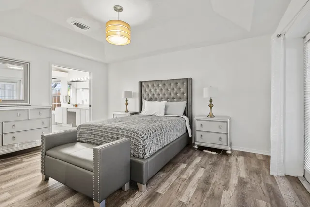 a bedroom with a bed and window