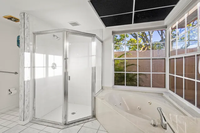 a spacious bathroom with a double vanity sink mirror and a
