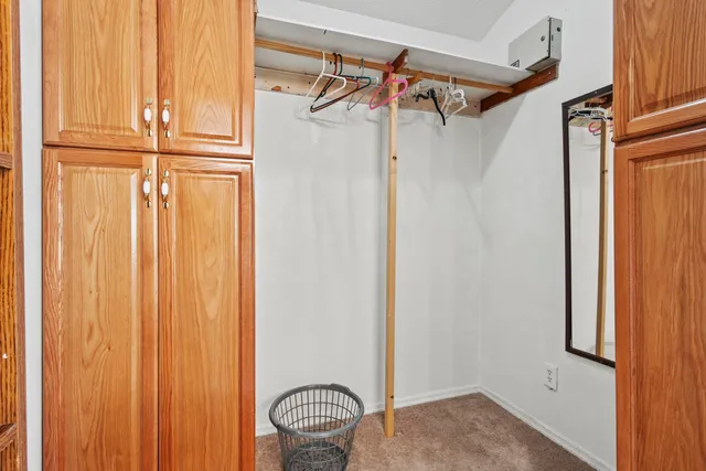 a kitchen with stainless steel appliances granite countertop a refrigerator and a stove