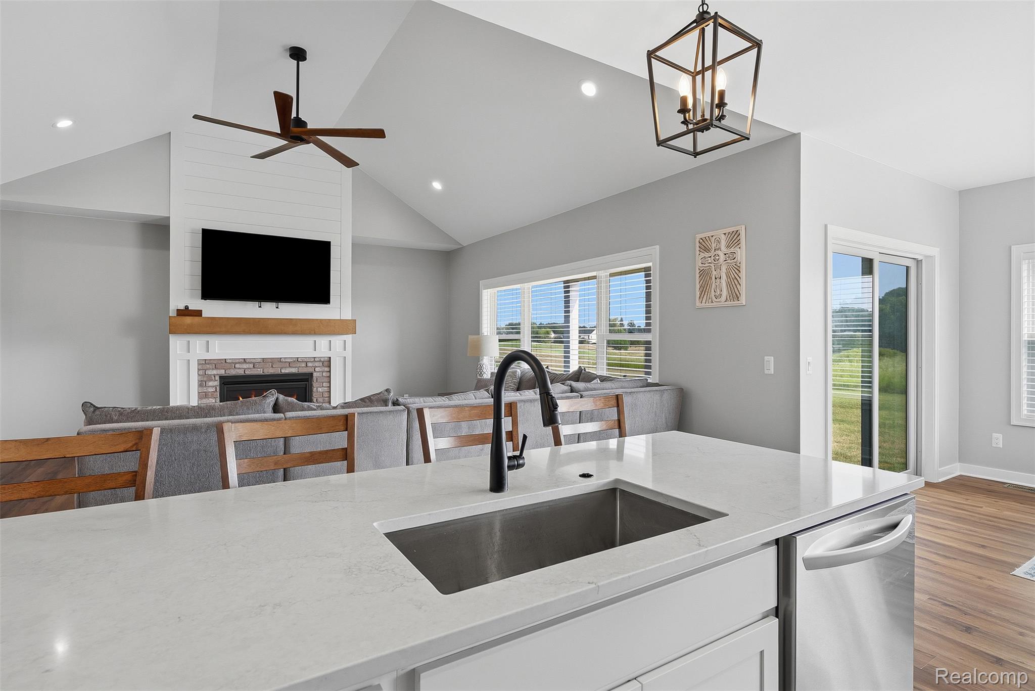 9087 Copper Ridge Drive Davison, MI 48423 - Photo 22 of 46 Kitchen island with a stainless steel sink and matte black faucet