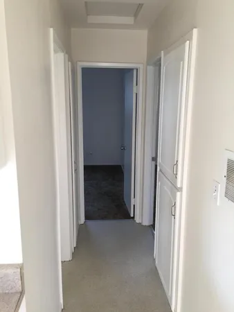 a view of a livingroom from a hallway