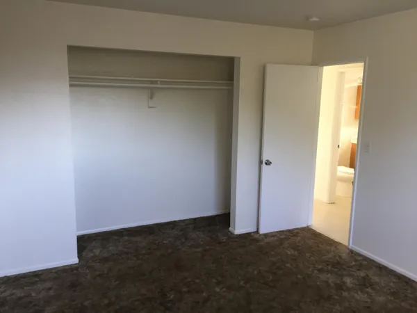 a kitchen with a cabinets and wooden floor