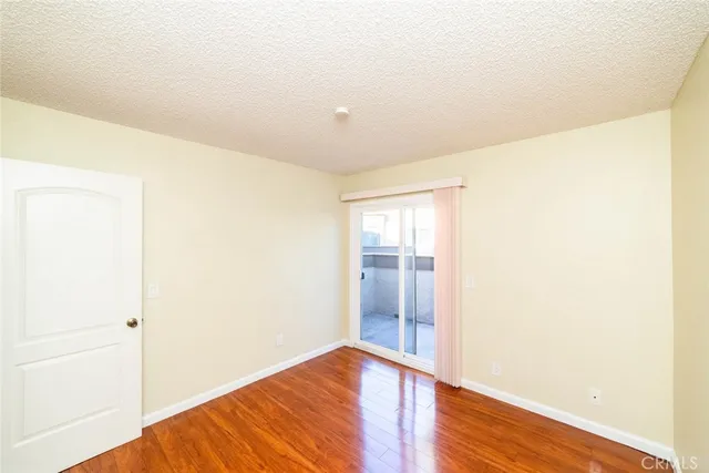 a view of hallway with wooden floor