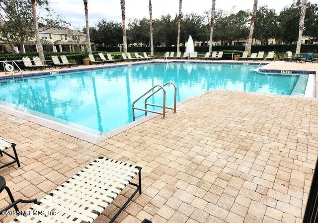 a view of a park with large trees