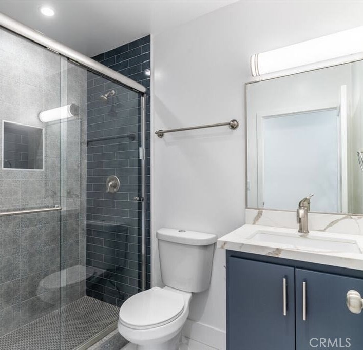 1213 West 24th Street Los Angeles, CA 90007 - Photo 5 of 11 a bathroom with a sink a toilet and shower