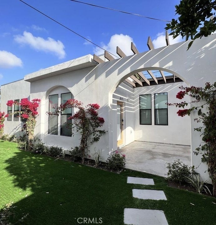 1213 West 24th Street Los Angeles, CA 90007 - Photo 8 of 11 a front view of a house with a yard