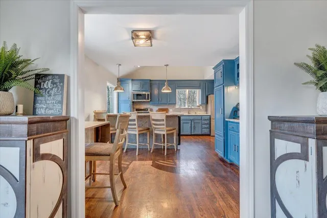 a view of a livingroom with furniture and a flat screen tv