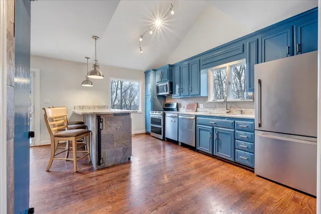 a view of a chairs and table in the balcony