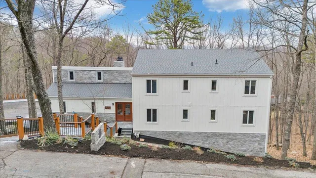 a view of a yard with wooden fence