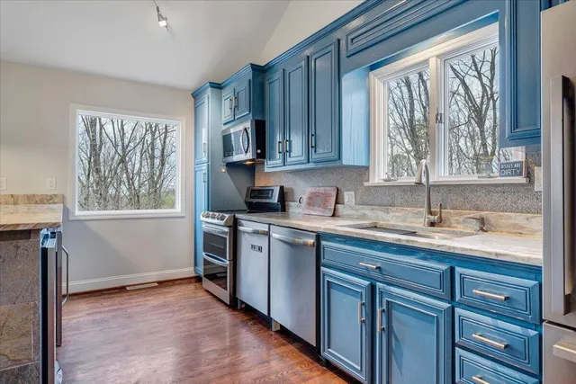 a view of a backyard of the house