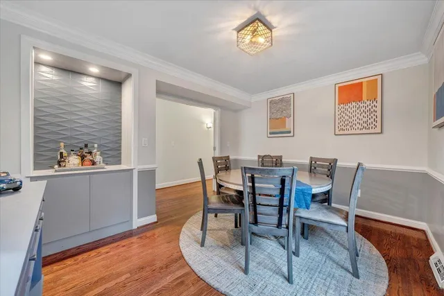 a spacious bathroom with a sink a toilet a mirror and shower