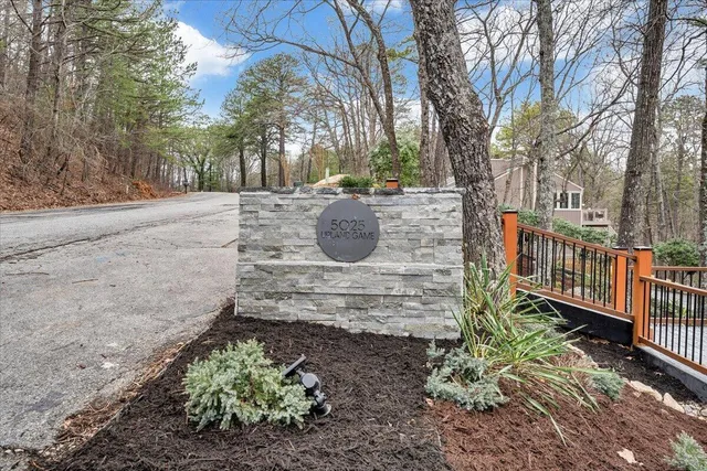 a front view of a house with large windows