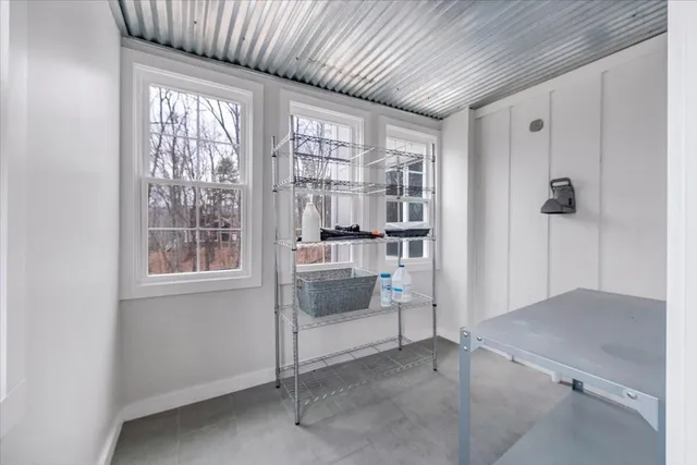 a bedroom with furniture and a wooden floor