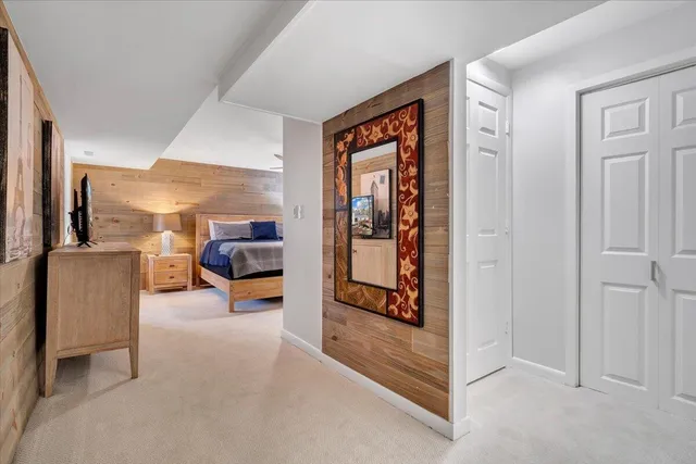 a view of room with a large window and wooden floor